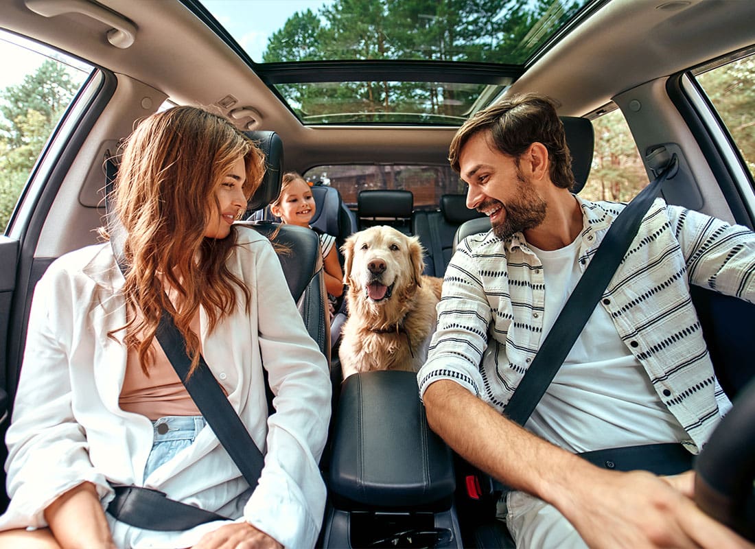 Insurance Solutions - Happy Family Taking a Drive For the Weekend On a Nice Day